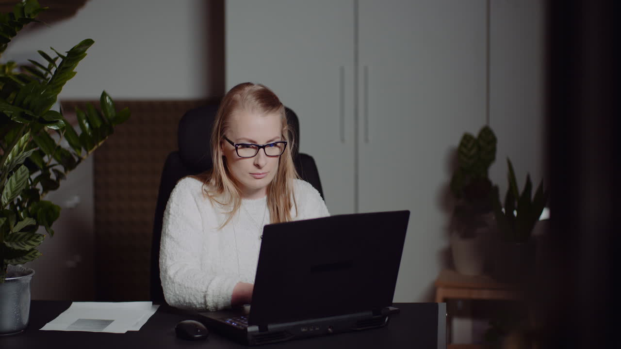 Modern Businesswoman Working On Laptop Late At Night