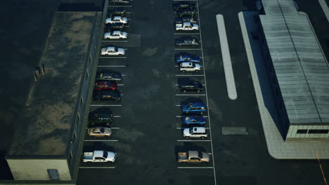 aerial view of an empty parking lot with cars