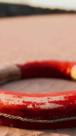 closeup of an old life preserver on the beach