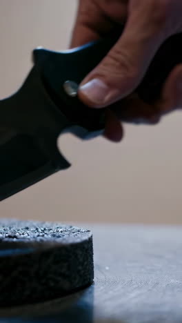 sharpening a black knife