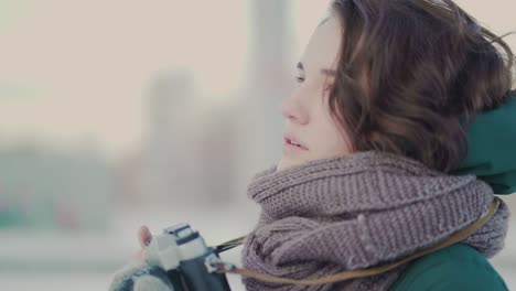 woman taking photos in winter city