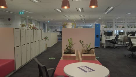 Empty-open-plan-hot-desk-green-office-set-up-and-lockers