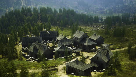 historic village nestled in a mountainous forest landscape during daylight