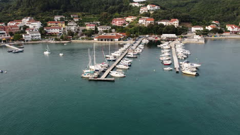 Drone-Aerial-View,-Marina-at-Rab-Island-Croatia-Coast,-Sailing-Boats-and-Yachts-in-Kampor-on-Summer-Day