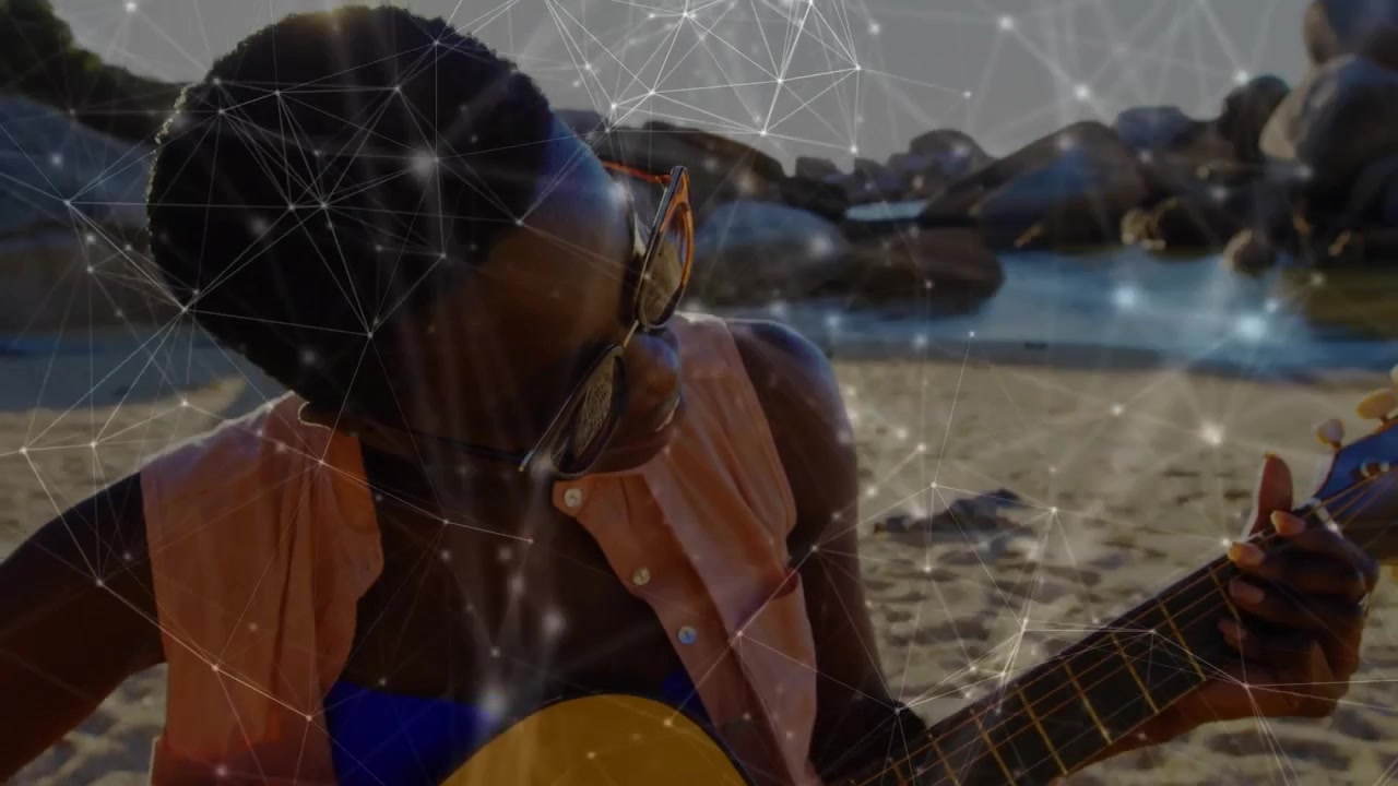 Fading digital technology overlay initiating woman placing guitar on sand showing melodic chords