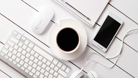Devices-and-stationery-near-hot-drink