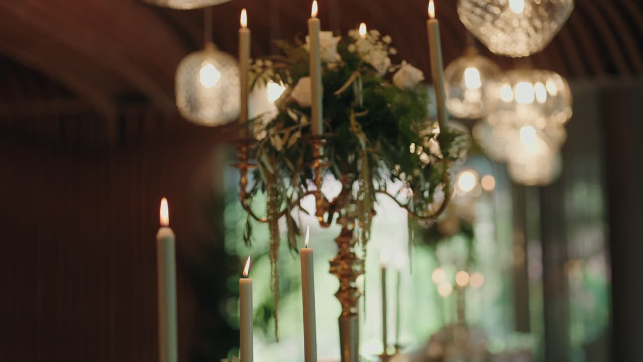 rotating wedding cake with white roses and golden ribbon detail
