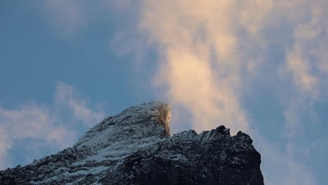 flowing orange clouds over the mountain top