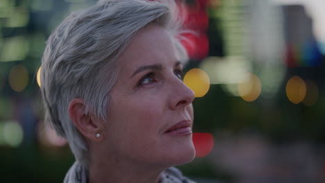 close up portrait successful senior business woman looking pensive enjoying successful retirement lifestyle confident professional female in evening city at night