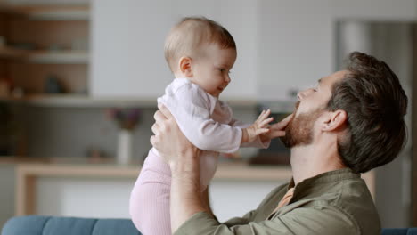 father and baby girl interact