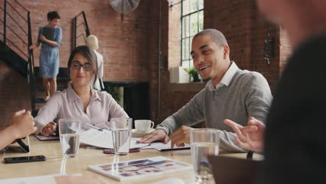 steadicam shot in of diverse business team meeting