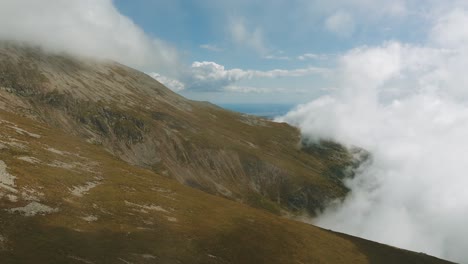 majestic mountain landscape with clouds and fog