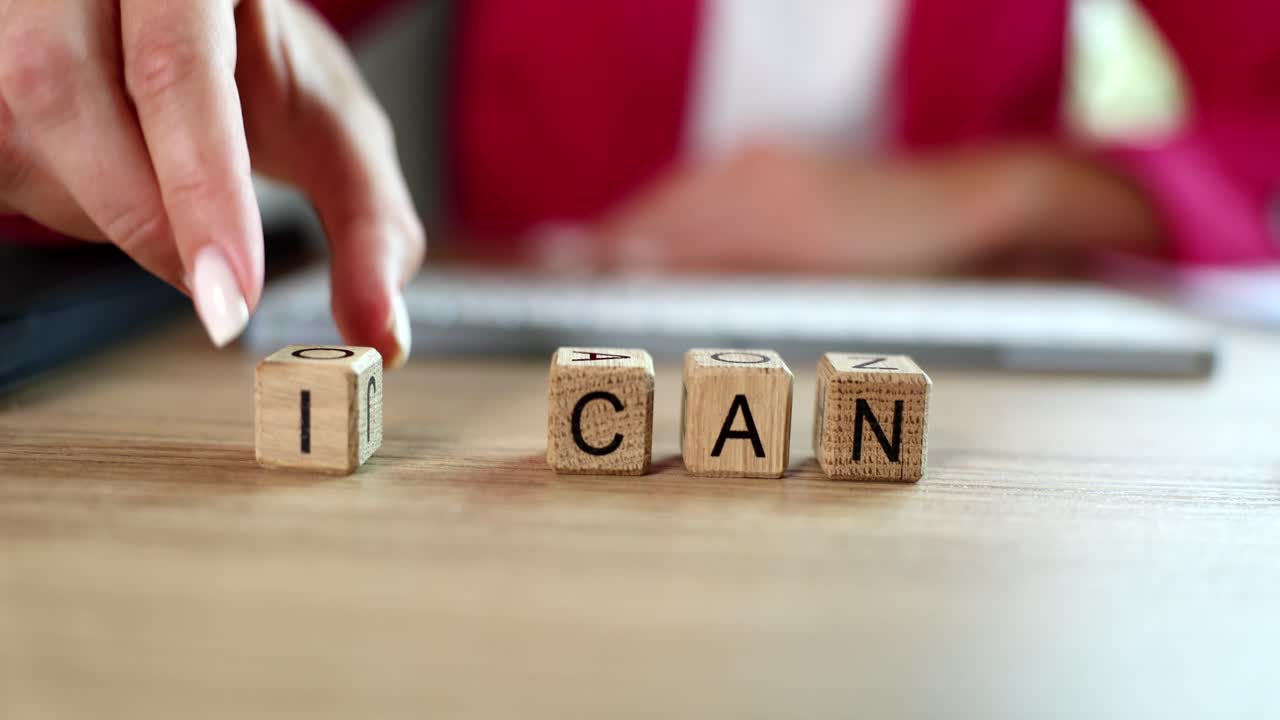 Motivational concept with I CAN spelled out on wooden blocks