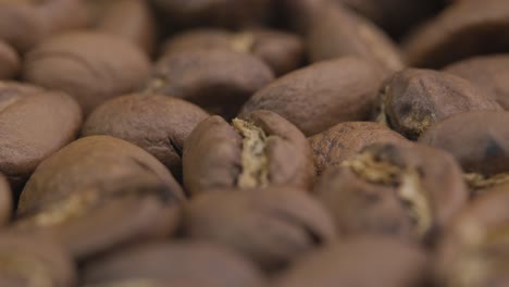 Abstract-macro-close-up-of-roasted-coffee-beans,-slow-zoom-out