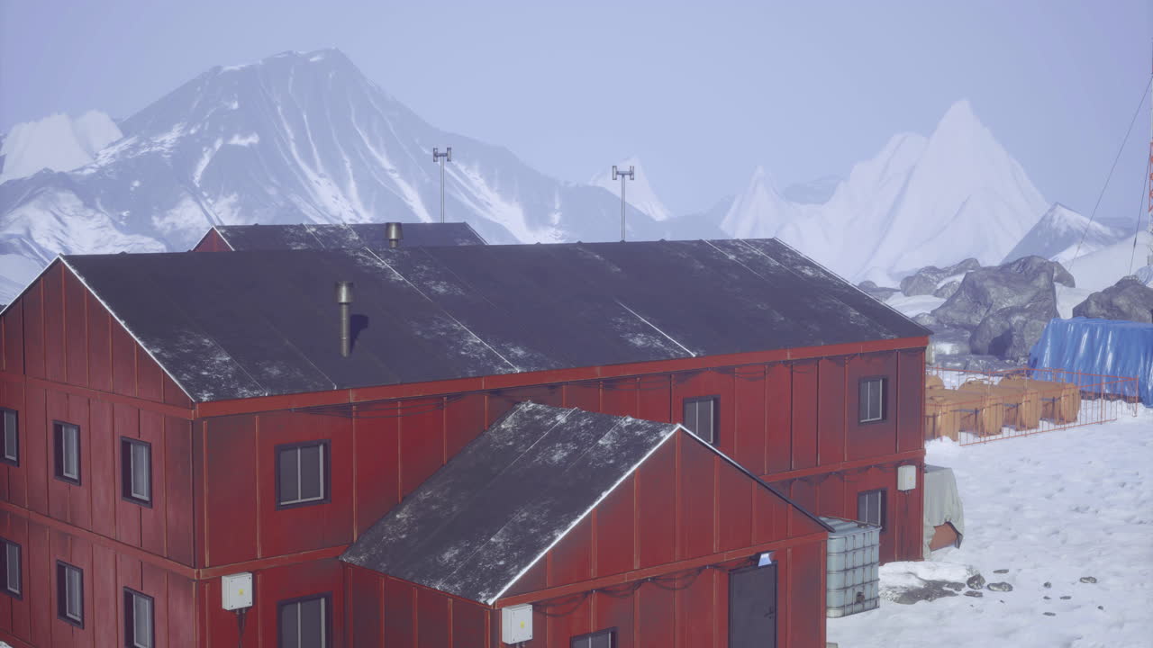 Research station located in a snowy landscape near a mountain range