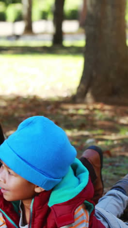 family taking selfie in the park