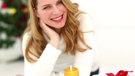festive blonde with christmas candle