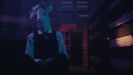 person wearing goat mask