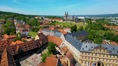 4k aerial drone video of the historic neue residenz palace and michaelsberg abbey in the old town area of bamberg, germany (high speed)