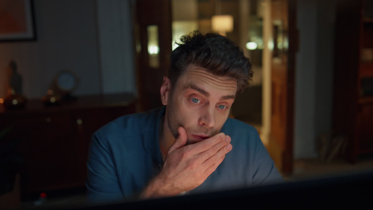 Closeup exhausted businessman working late night at room. Man having deadline