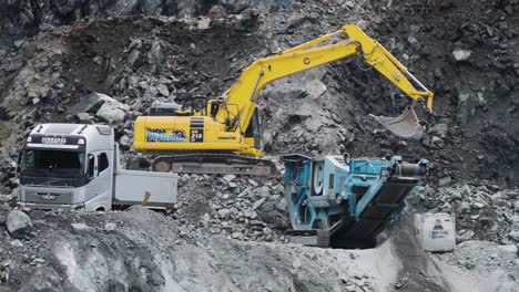 heavy machinery at work in a rock quarry