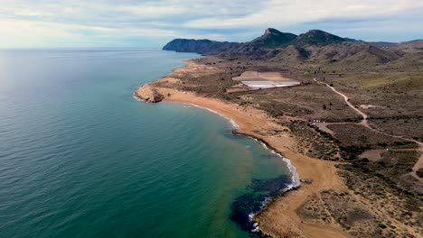 calblanque coast aerial drone view point of coastline of mountains against mediterranean seascape in cartagena coasts, spain