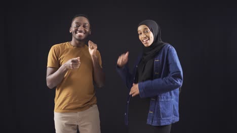 Cute-african-amateur-dancers-dancing-on-black-background.