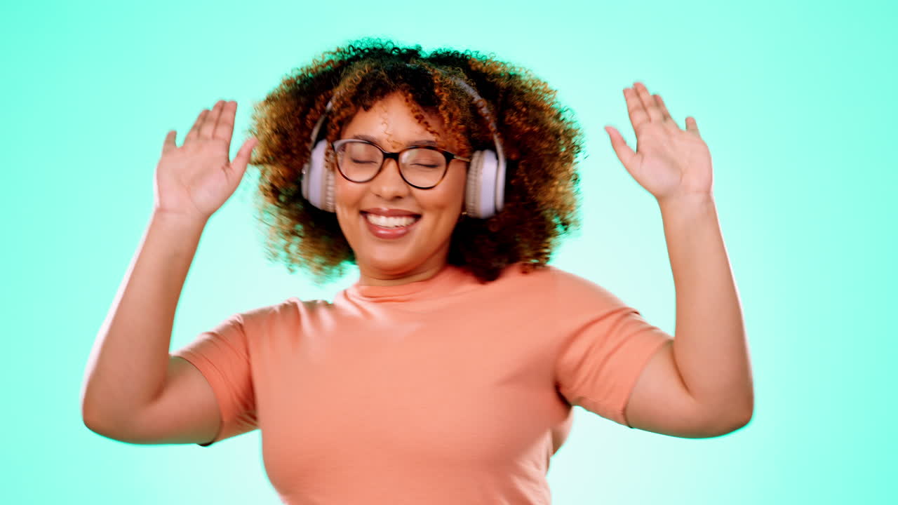 Headphones, dance and black woman in studio