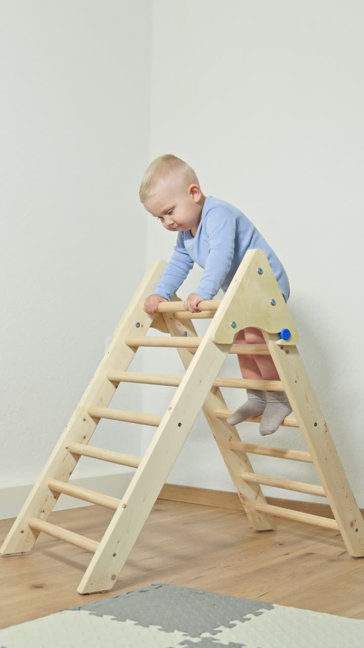 A toddler is happily engaged in play on a sturdy wooden climbing frame, which aids in developing vital motor skills and coordination necessary for their growth and overall development