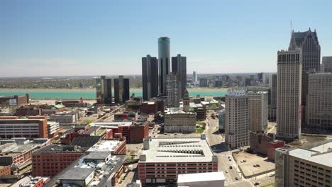 renaissance center, world headquarters of general motors, in detroit, michigan with drone video moving sideways