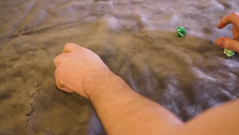 various dice, greens, limes, resting on green felt