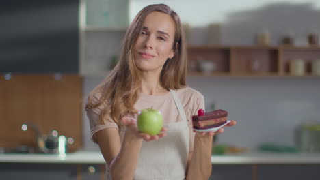 Woman-choosing-between-apple-or-cake