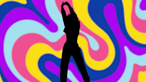 studio silhouette of woman dancing against multi coloured pattern background