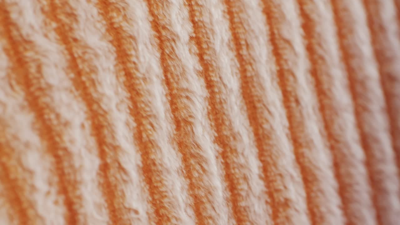 Detailed orange and white striped textured fabric, ideal for textiles and patterns. Perfect for apparel and crafts
