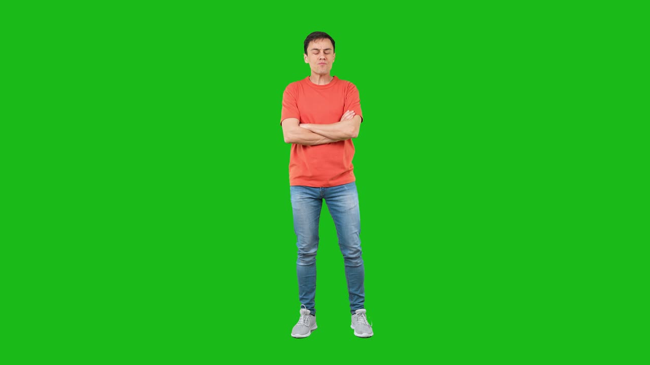 Man in Orange T-shirt and Jeans Making Various Expressions and Gestures on Green Screen