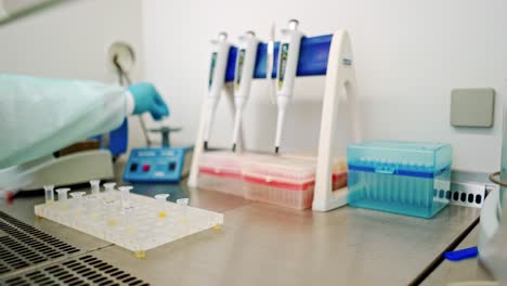 analysis in small plastic tubes on a rack. laboratory background and technician making experiments with test tubes on the table. close-up.