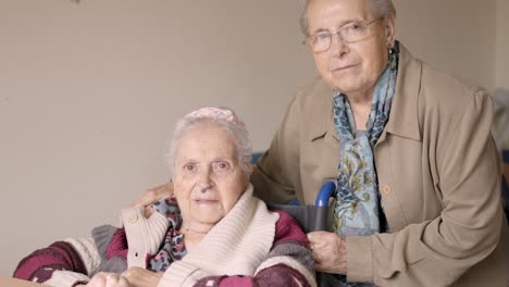 senior women looking at camera together in a nursing home