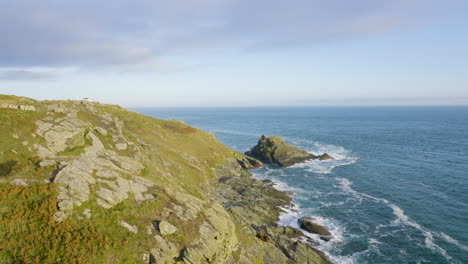 coastal scenery with rocky cliffs and waves