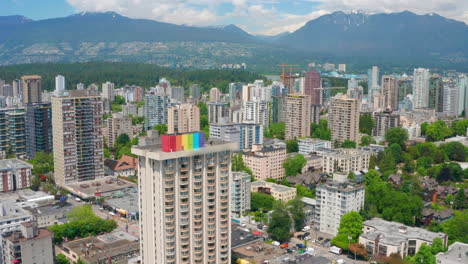 The-Skyline-Of-West-End-Downtown-Vancouver-With-Mountain-Range-And-Blue-Sky-Background