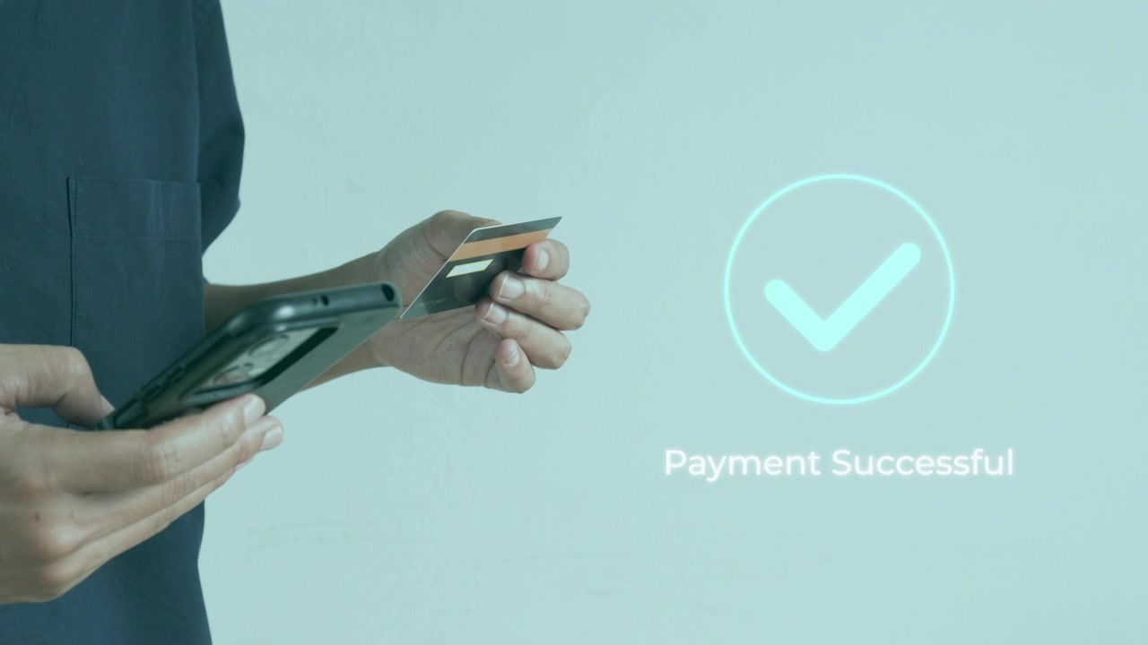 Casual man holding credit card and smart phone for successful touchless digital payment
