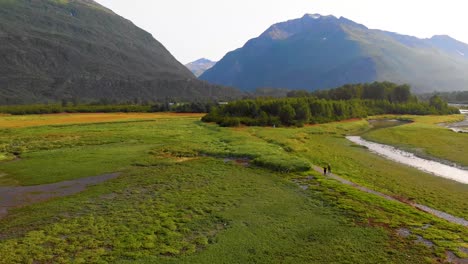 4k drone video of mountains surrounding port valdez in valdez ak during sunny summer day