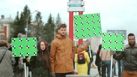 multicultural diverse crowd of protest activists with blank mockup placards.