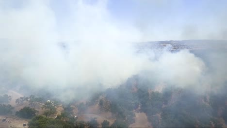 AERIAL---West-coast-California-fire-burns-brush