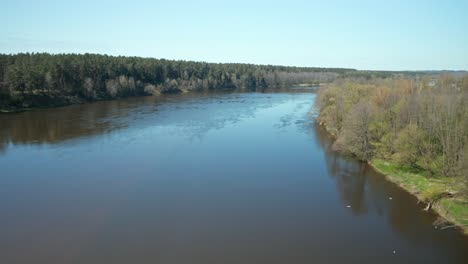 AERIAL:-Reveal-Shot-and-Flying-Above-River-Nemunas-on-Sunny-Day