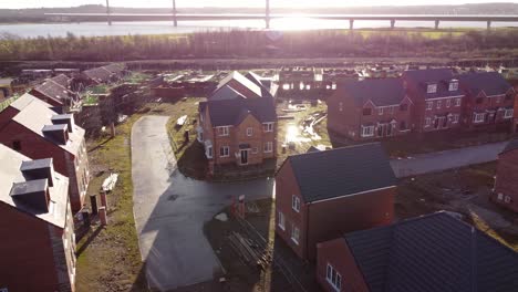 unfinished waterfront sunlit townhouse property development construction site aerial view