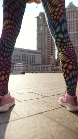 woman stretching outdoors in the city