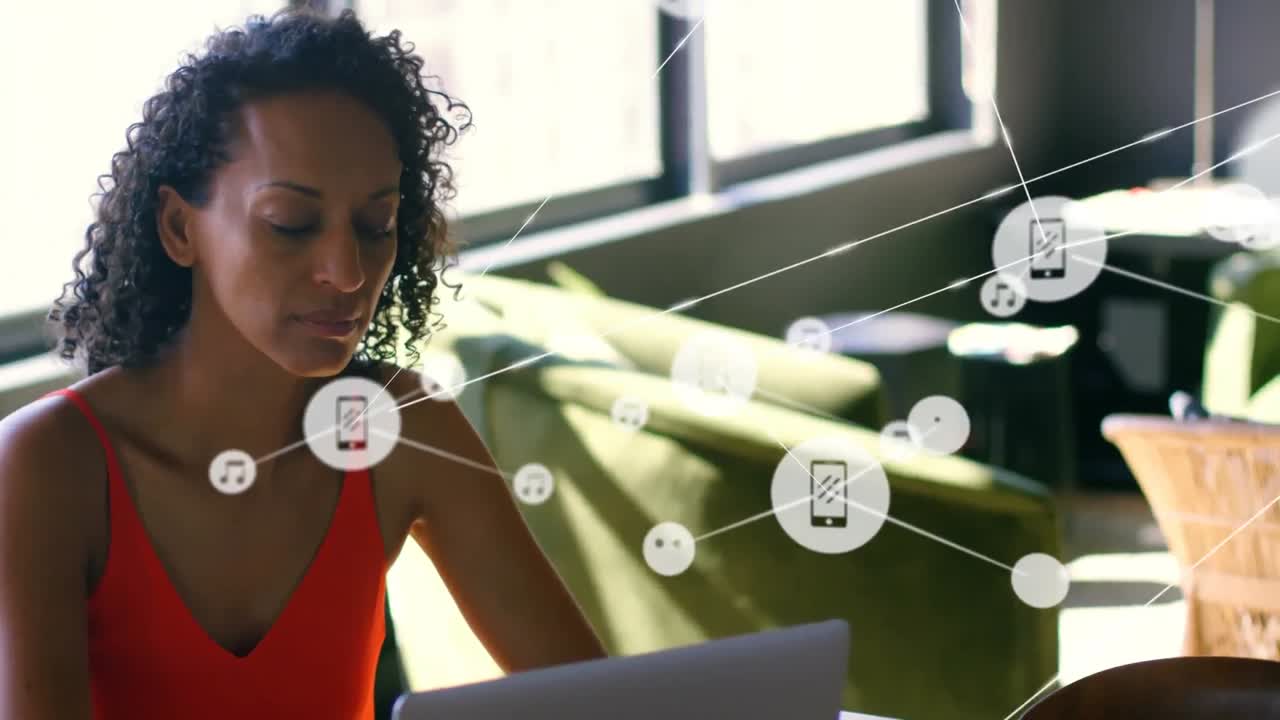 Animation of network of connections with icons over woman using laptop