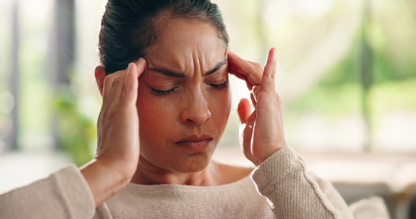 Stressed Woman Rubbing Her Temples Suffering From Headache
