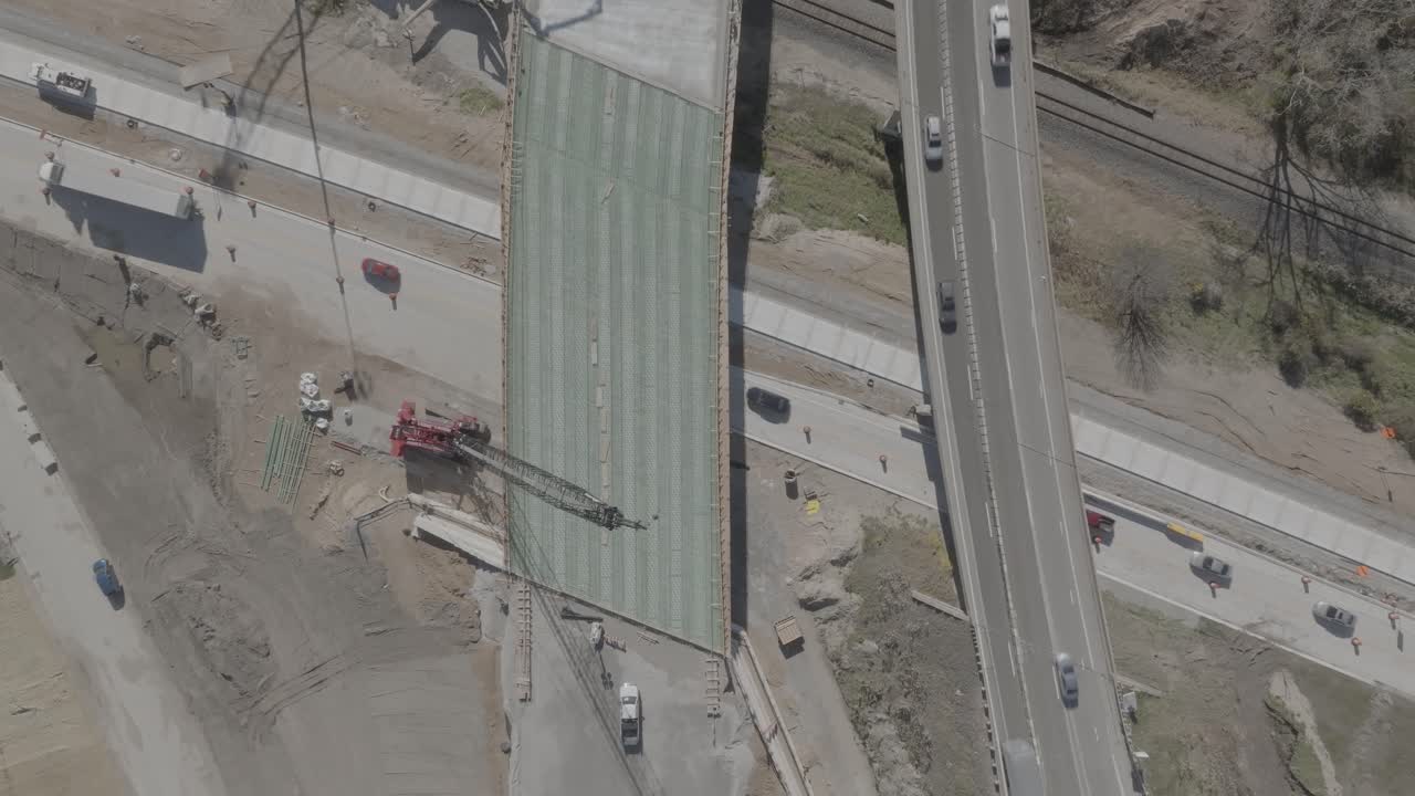 US 127 Trowbridge exit bridge and freeway construction with traffic driving and drone video overhead.
