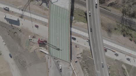 us 127 trowbridge exit bridge and freeway construction with traffic driving and drone video overhead.